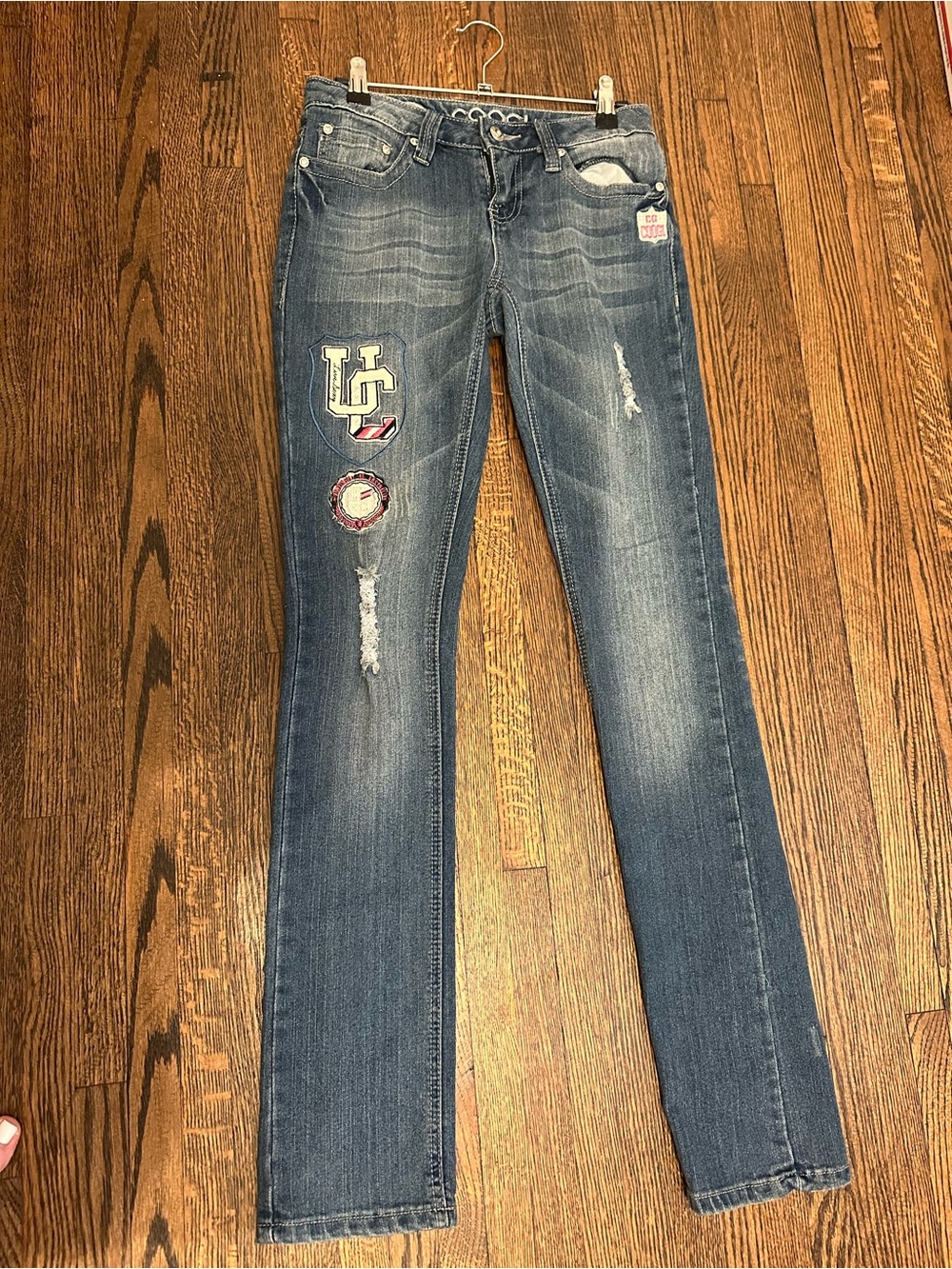 Coogi Women’s Distressed Collegiate Y2K Patch Skinny Jeans